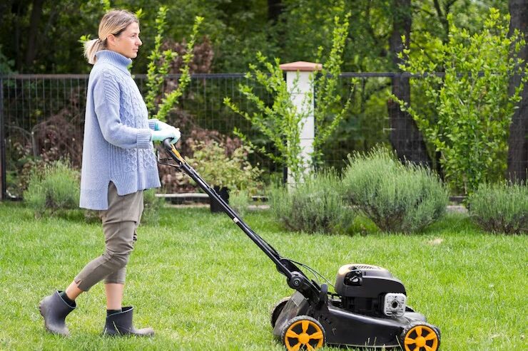 Lawn Care for Beginners: Step-by-Step Guide for USA Homeowners (2025) 3 imgi 25 long shot woman mowing yard 23 2148580100 edited